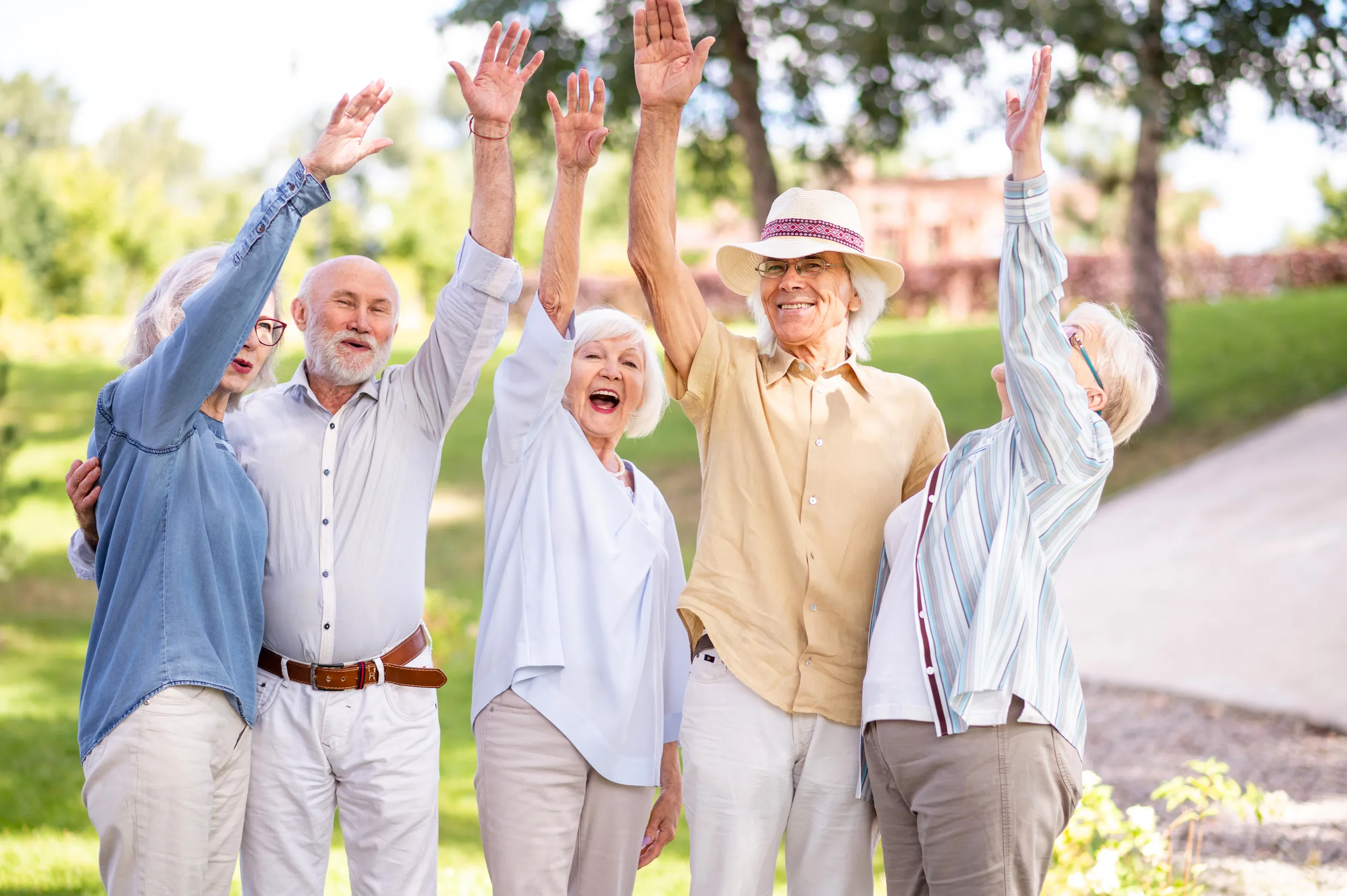 Group of happy elderly people bonding outdoors at the park Group of happy elderly people bonding outdoors at the park